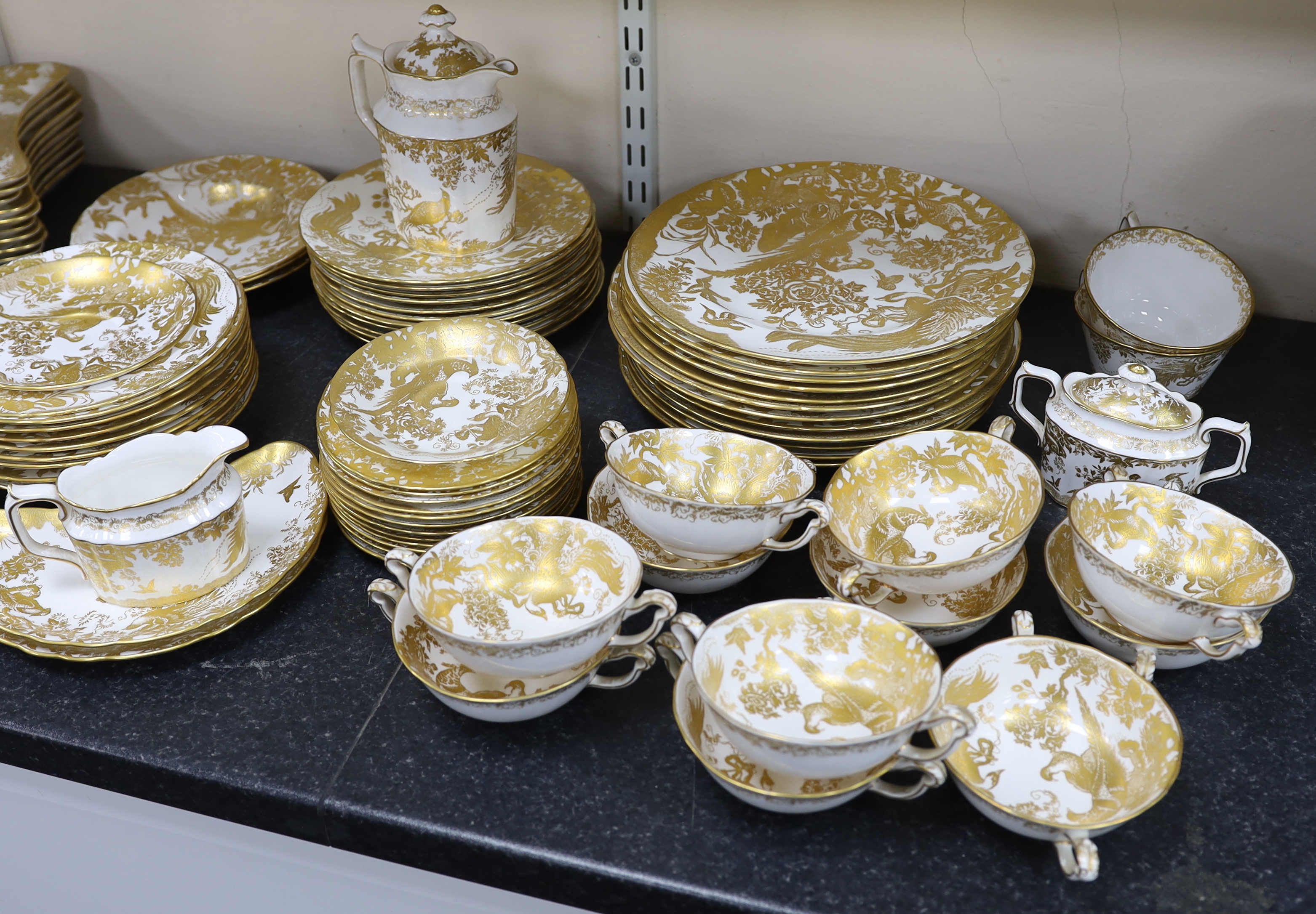 An extensive Royal Crown Derby Gold Aves dinner and tea service